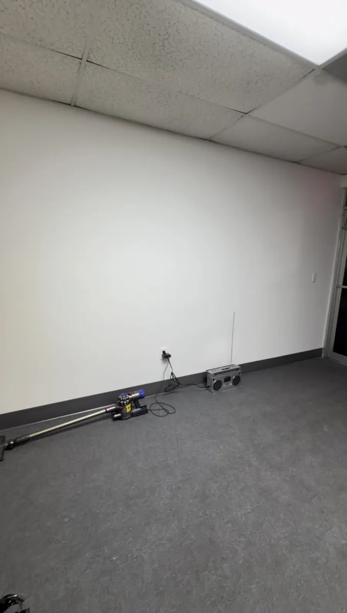 Before: Commercial slat media wall