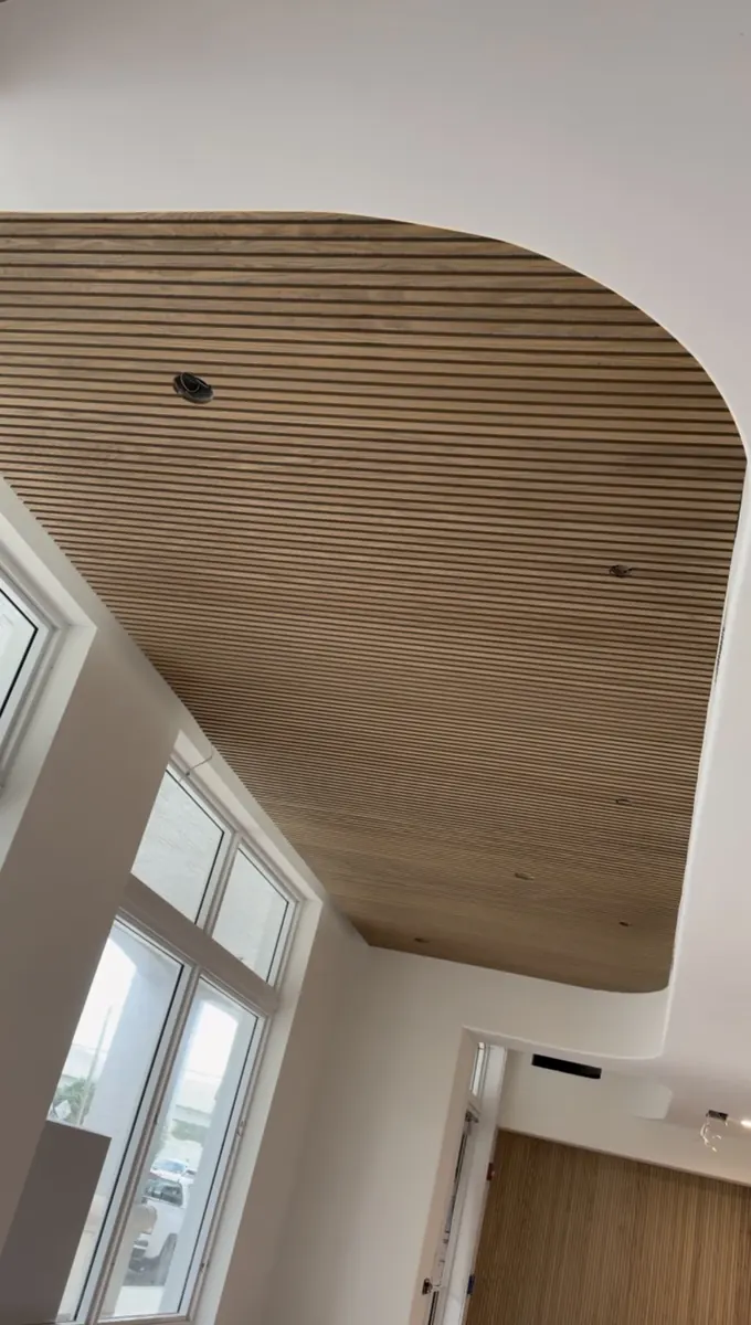 After: Interior wood-slat ceiling