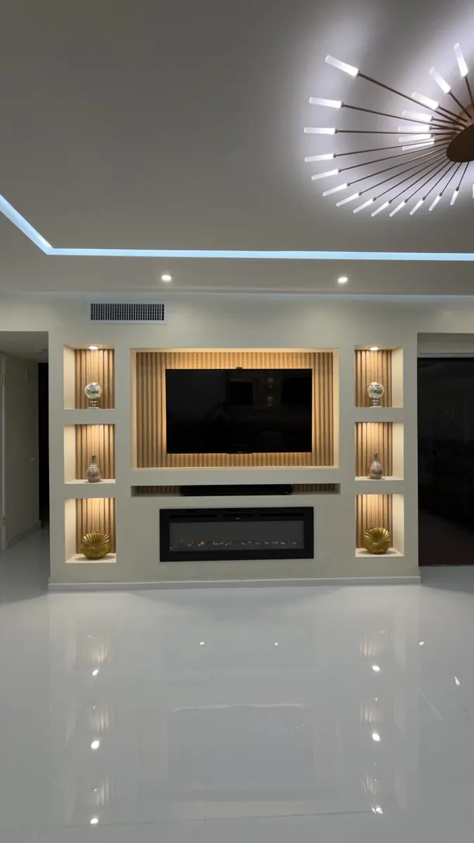 After: Slat media wall with fireplace